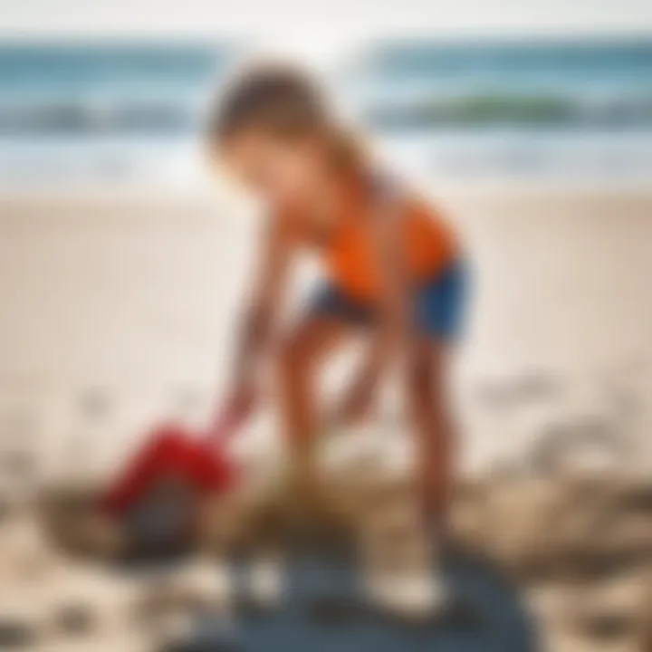 Child playing with a sand shovel on the beach