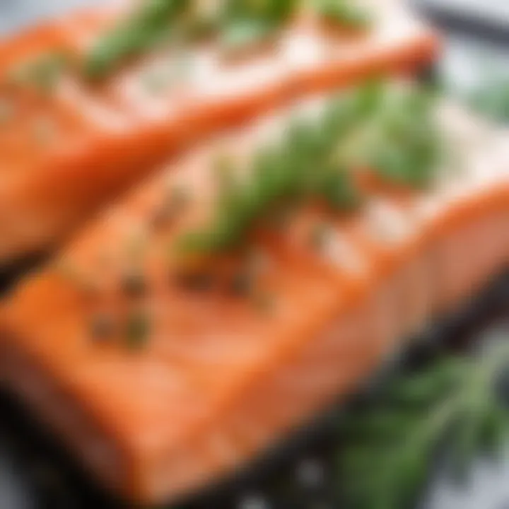 Close-up of cooked pink salmon garnished with herbs