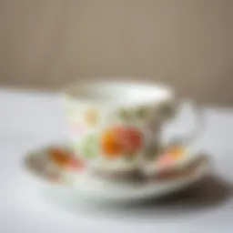 Elegant porcelain cup and saucer set showcasing intricate floral patterns