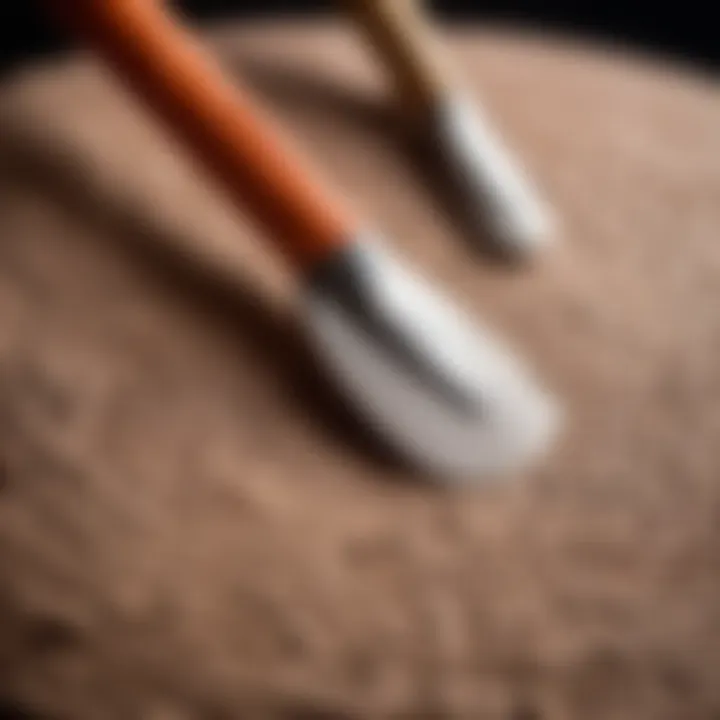 A close-up of textured air dry clay with sculpting tools