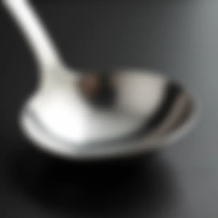 Close-up of the polished surface of a stainless steel ladle