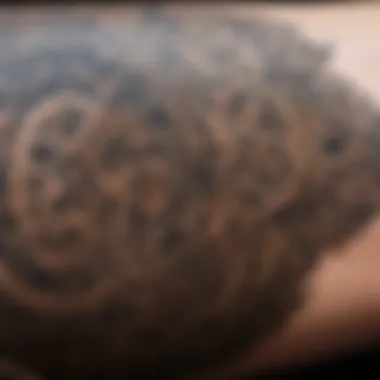 Close-up of intricate tattoo patterns representing elemental themes